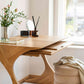 Interior arrangement with the Cervin Desk with a unique hourglass shape in solid oak wood