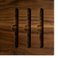 Tray detail of the Cervin desk with beautiful hourglass-shaped legs in solid walnut wood