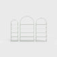 Arched bookcase Arkada, available in Switzerland through ÉTAUDORÉ, made from highest quality powdered coated steel in light matcha green color