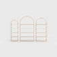 Arched bookcase Arkada, available in Switzerland through ÉTAUDORÉ, made from highest quality powdered coated steel in pastel salmon color