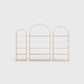 Arched bookcase Arkada, available in Switzerland through ÉTAUDORÉ, made from highest quality powdered coated steel in pastel salmon color