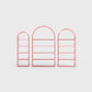 Arched bookcase Arkada, available in Switzerland through ÉTAUDORÉ, made from highest quality powdered coated steel in rose pink color