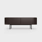 Curved Desiva Enna 01 lowboard in coffee brown color steel, available in Switzerland via ÉTAUDORÉ