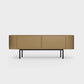 Curved Desiva Enna 01 lowboard in desert palm color steel, available in Switzerland via ÉTAUDORÉ