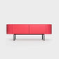 Curved Desiva Enna 01 lowboard in raspberry pink color steel, available in Switzerland via ÉTAUDORÉ