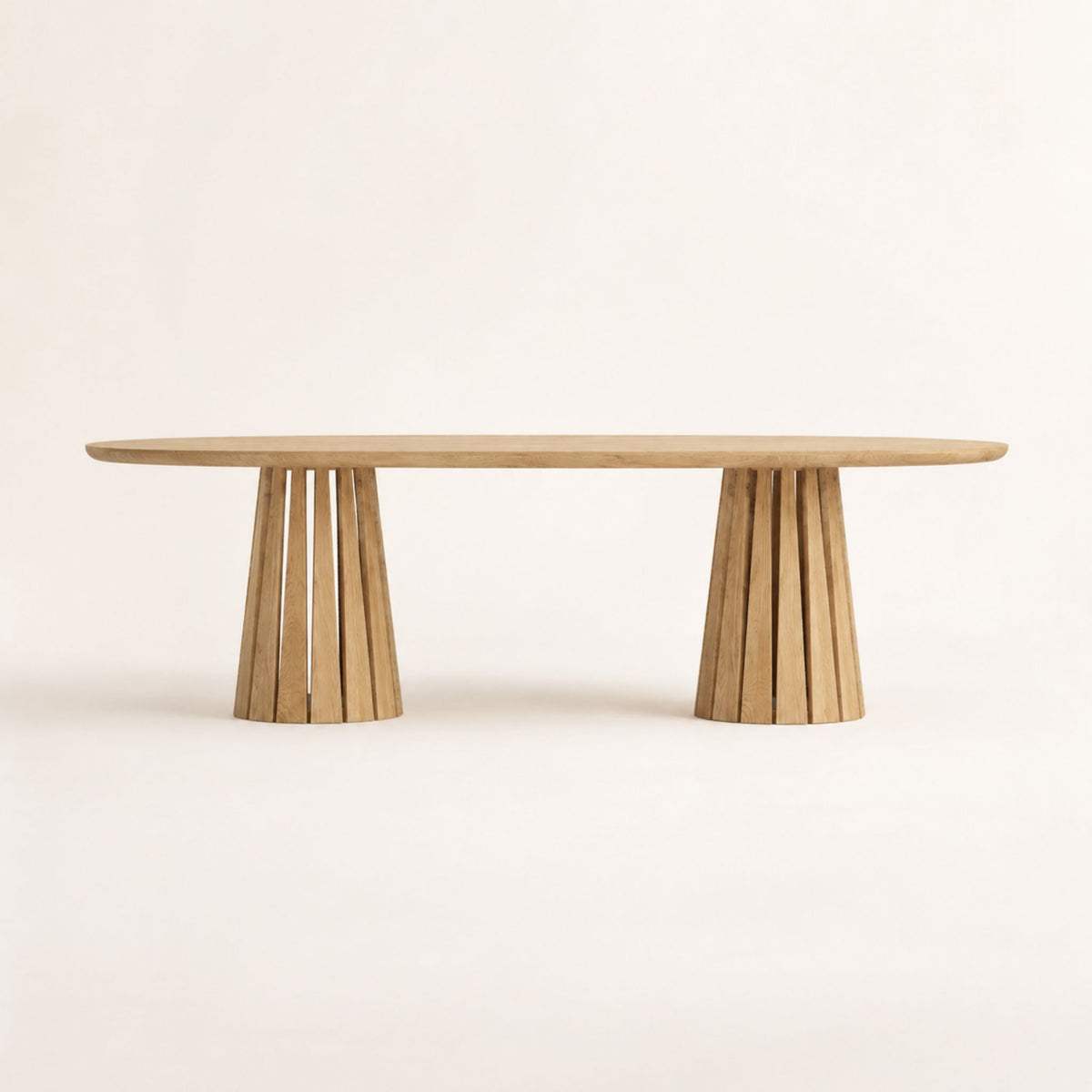 Front view of the ÉTAUDORÉ Noemi Rounded Oval Table in solid oak wood, designed in collaboration with Noemi Gwalter Rubino