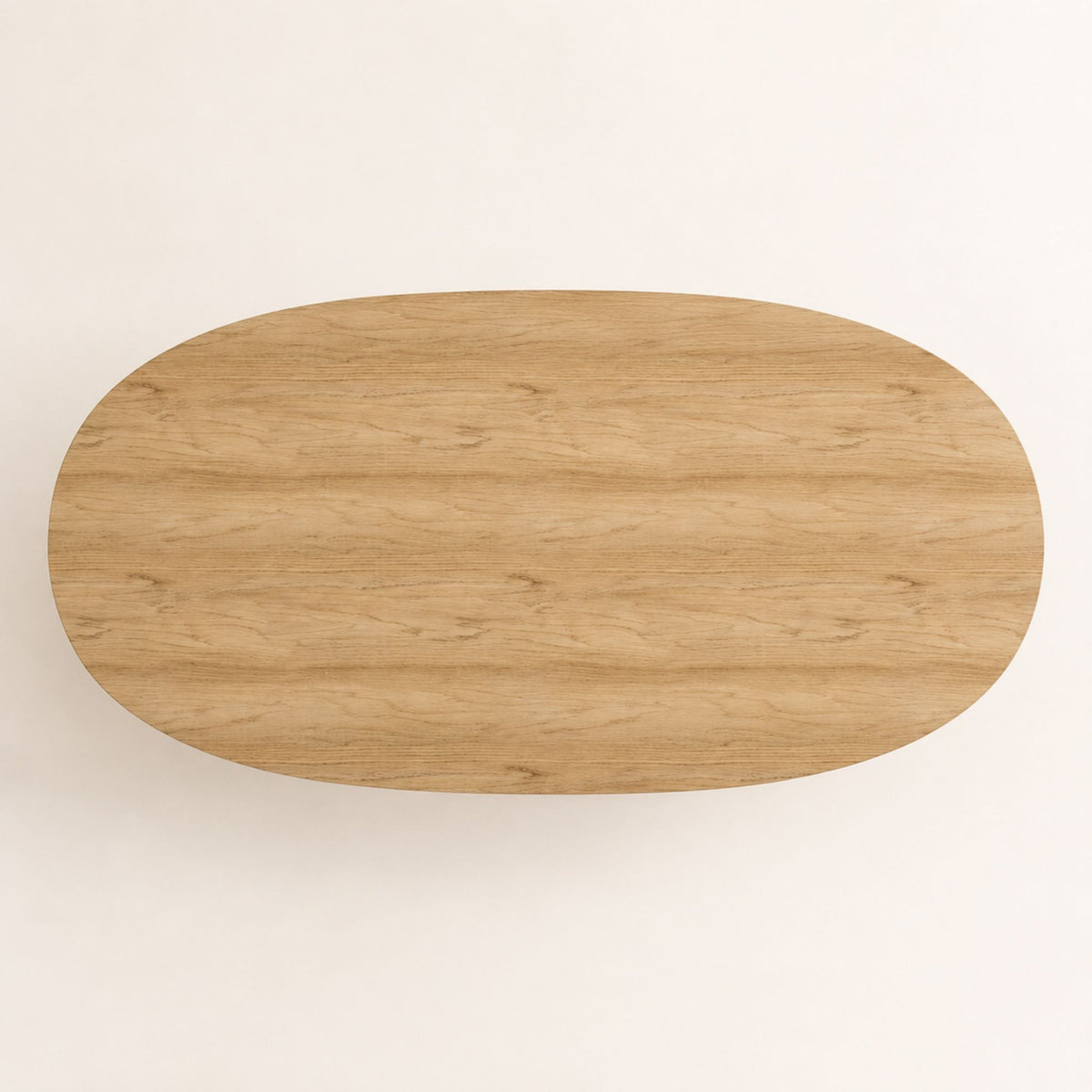 Tabletop view of the ÉTAUDORÉ Noemi Rounded Oval Table in solid oak wood, designed in collaboration with Noemi Gwalter Rubino