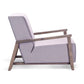 Side profile of ÉTAUDORÉ Reuss armchair highlighting relaxed reclined backrest and architectural beech wood base.
