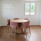 Rigi Round Table in solid oak in natural finish , together with Uetliberg chairs in natural finish and MARE 11 fabric