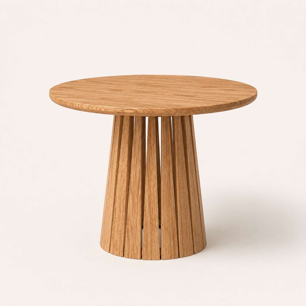 Round Rigi table from ÉTAUDORÉ in solid oak wood with a beautiful base in a chestnut finish