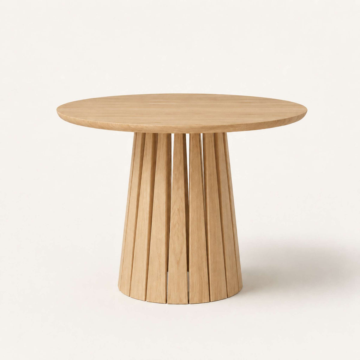 Round Rigi table from ÉTAUDORÉ in solid oak wood with a beautiful base in a natural finish