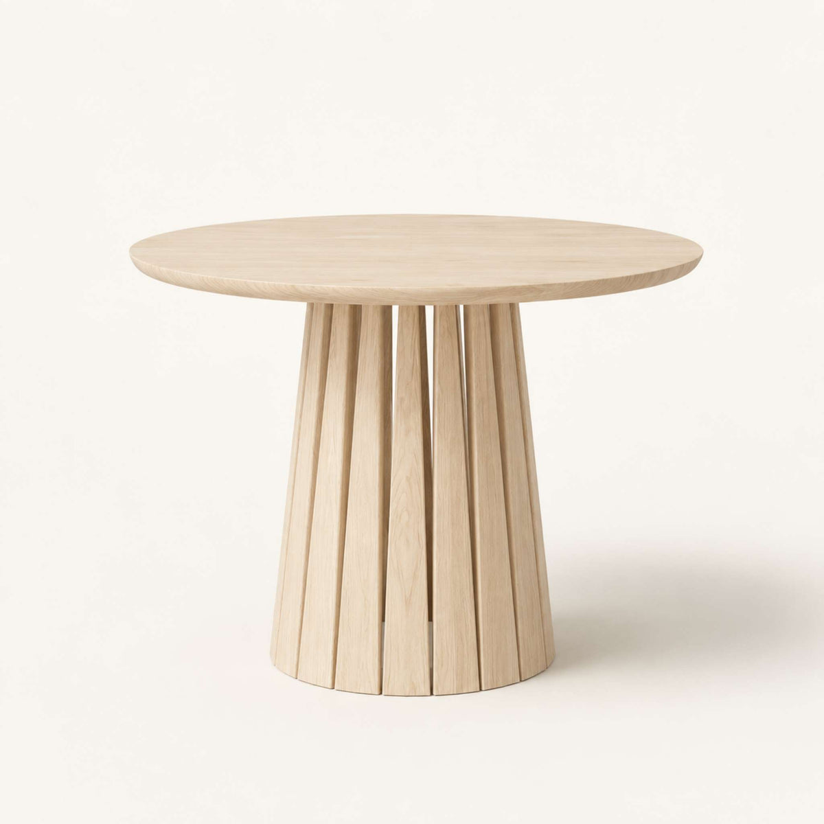 Round Rigi table from ÉTAUDORÉ in solid oak wood with a beautiful base in a whitewashed finish